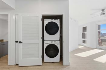White laundry room with a washer and dryer in it2